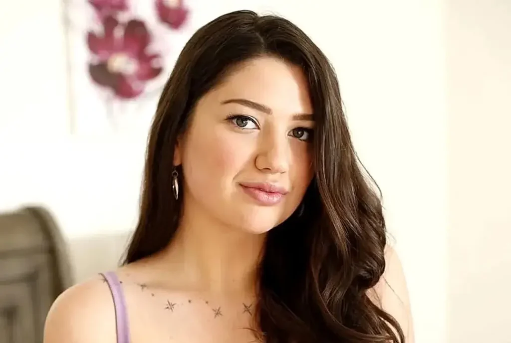 Alyx Star portrait showing brown hair and hazel eyes